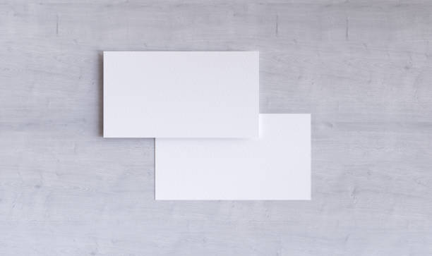 istock Business card mockup on white wood background 2181297872