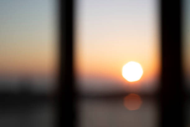 defocus light effect of sunrise seen from window