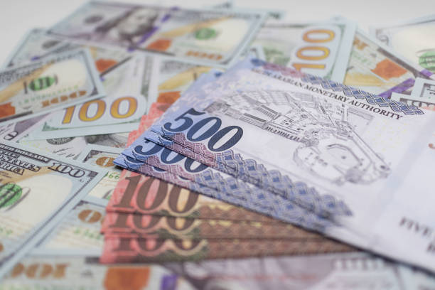 istock Blue and Brown Riyal Bills with US Dollar Background. 2181300451