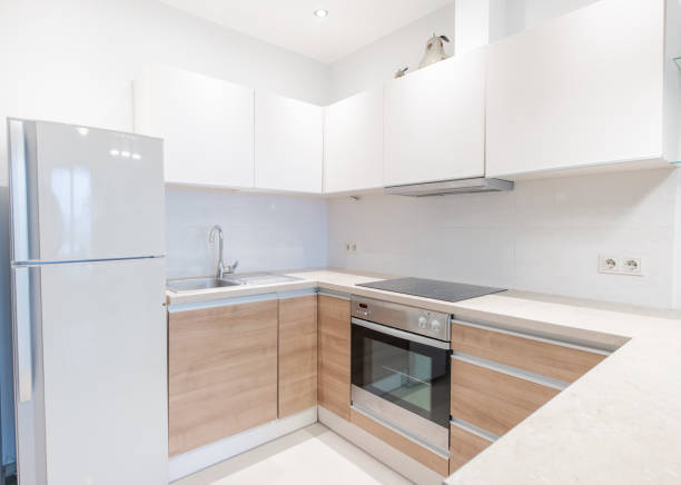 istock Scandinavian Style Cozy Modern Open Bright Kitchen Home Interior. Faucet, Oven, Fridge and Furniture in Background. 2181305680