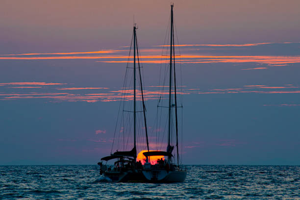 Argentario, Tuscany, Italy: The sun sets behind the sailboats