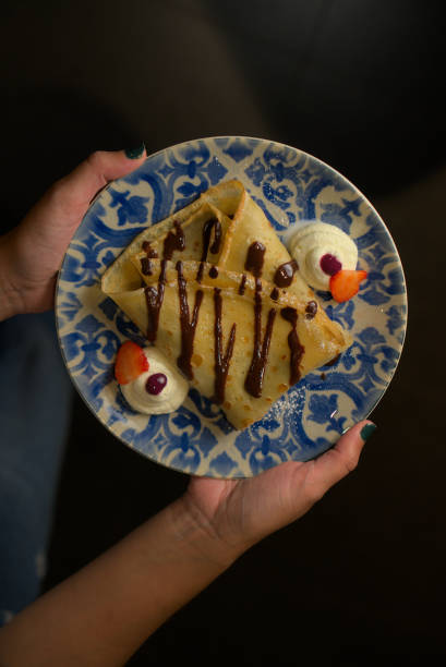 istock Stylish Dessert Plate with Chocolate-Drizzled Crepes 2181307675