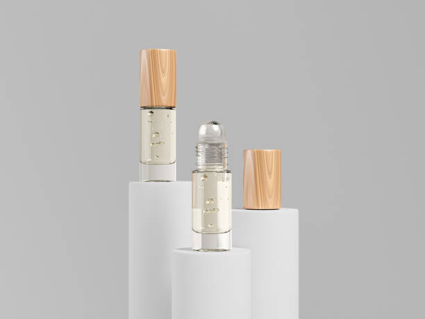 Roller bottles mockup, empty label of open wood cap, clear glass, metallic ball roller bottles, aroma oil roll on packaging, cylindrical shape containers, luxury liquid cologne display on pedestal