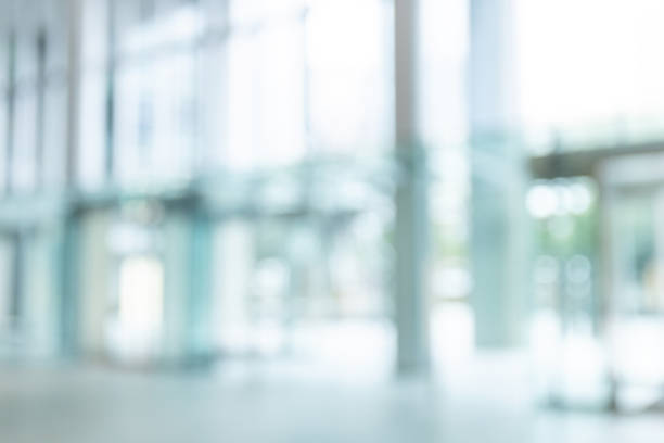 glass-fronted lobby with blurred background. - oskarpt fokus bildbanksfoton och bilder