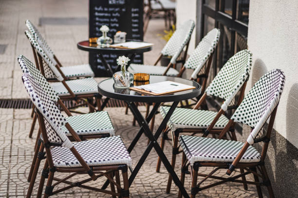istock Outdoor Cafe Seating Arrangement With Empty Tables and Chairs 2181310856