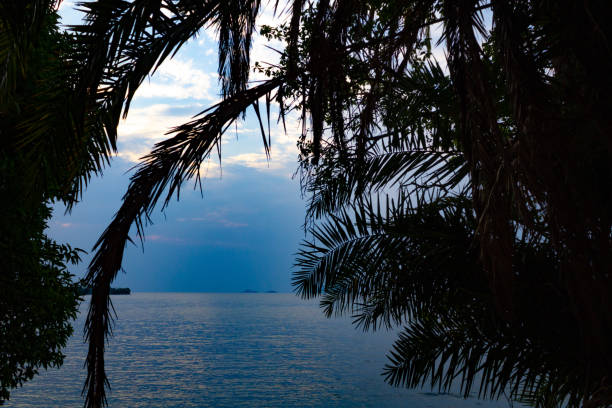 The sunset and the blue sky mixed with the orange of the sun. Reflecting the color of the sea, beautiful in Thailand.