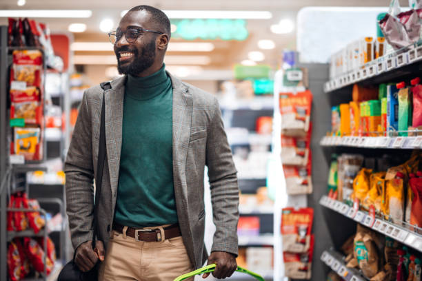 istock Smiling Man Shopping in a Grocery Store Aisle 2181312981