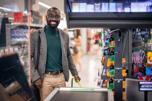 istock Confident Man Smiling in Modern Supermarket Checkout Line 2181313091
