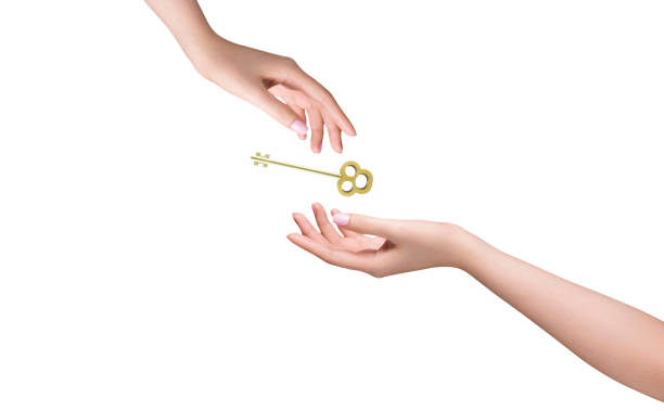 istock Hands giving and receiving key isolated on background 2181313126