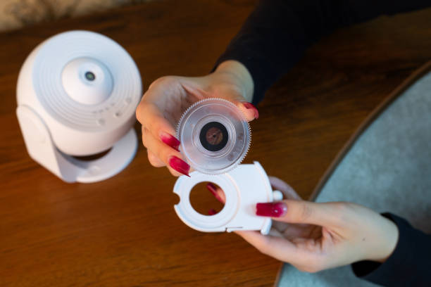Installing film disc in cartridge for galactic starry sky projector
