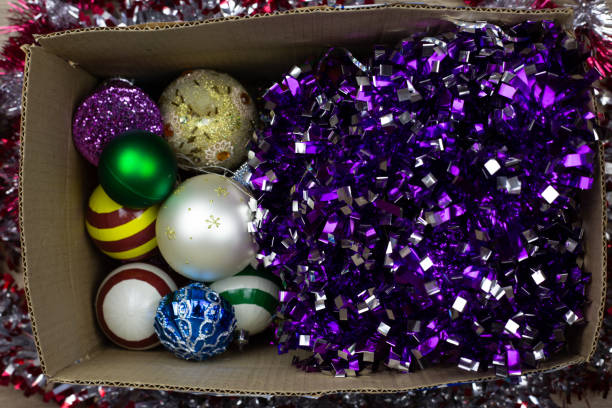 istock New Year balls for Christmas tree in cardboard box, top view 2181317489