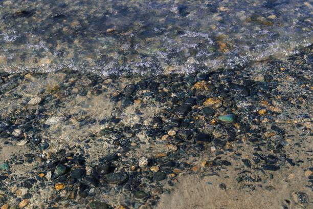 istock Colorful stones under clear water 2181318848