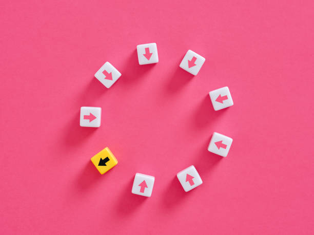 Yellow cube going opposite direction of white cubes