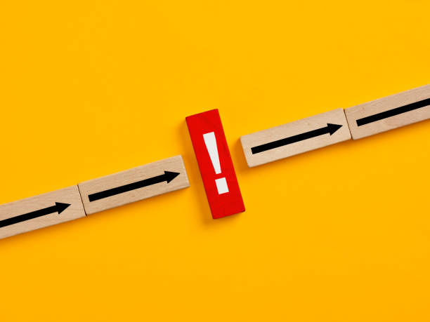 istock Exclamation mark stopping three arrows on yellow background 2181319251