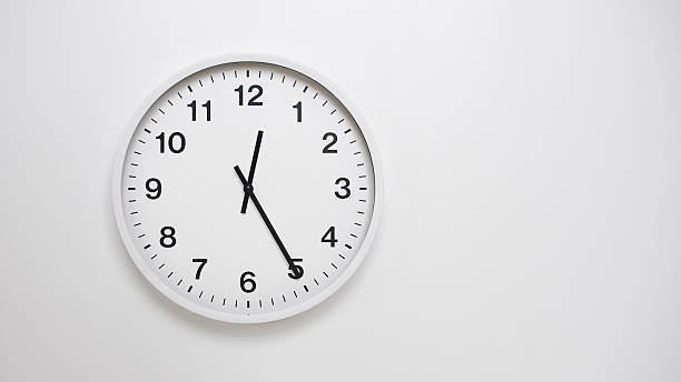 Isolated on white background Minimalist style wooden wall clock, showing time at  00.25, 12.25 - Perfect for Time Management and Scheduling Concepts