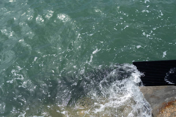 Waves patting the stone steps at the shore