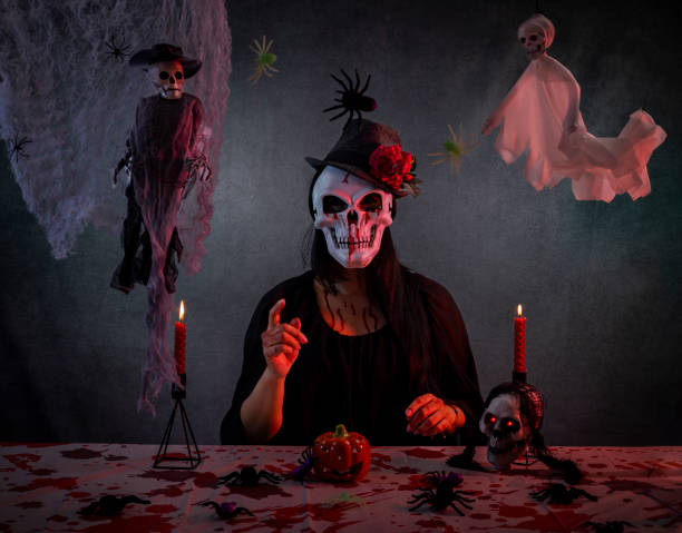 istock Intense dramatic scene with a figure in a skeletal mask and dark cloak. 2181321449
