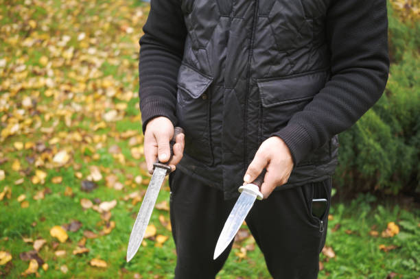 istock man holding two knives 2181322119