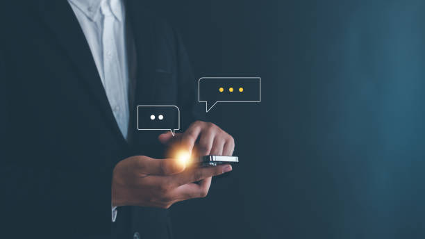 istock Hand using smartphone typing Live chat chatting and social network concepts, chatting conversation working at home in chat box icons pop up. Social media marketing technology concept. 2181327485