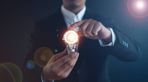 istock The idea of inspiration from online technology. innovation idea concept.with a light bulb And there is a gear icon in it And he is using a notebook computer. 2181327654