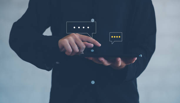 istock Hand using smartphone typing Live chat chatting and social network concepts, chatting conversation working at home in chat box icons pop up. Social media marketing technology concept. 2181329447