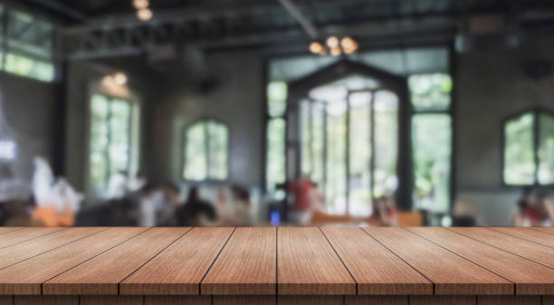 istock Empty wooden table top with lights bokeh on blur restaurant background. 2181333862