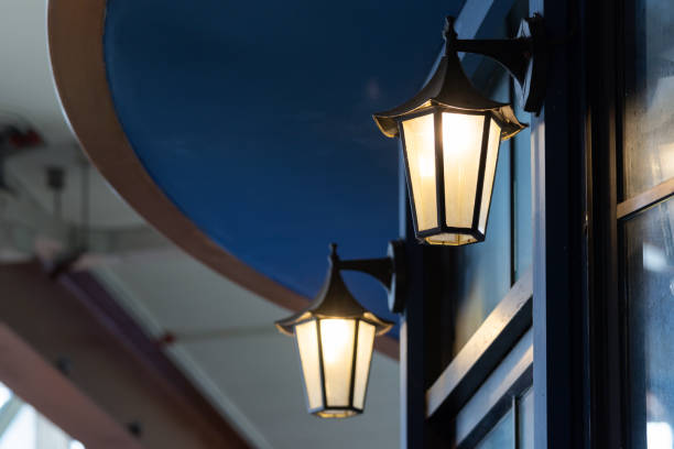 istock Two street lamps are lit up against a blue ceiling. 2181336227