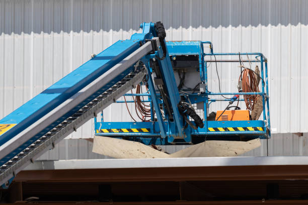 istock A blue crane is lifting a piece of equipment 2181336237