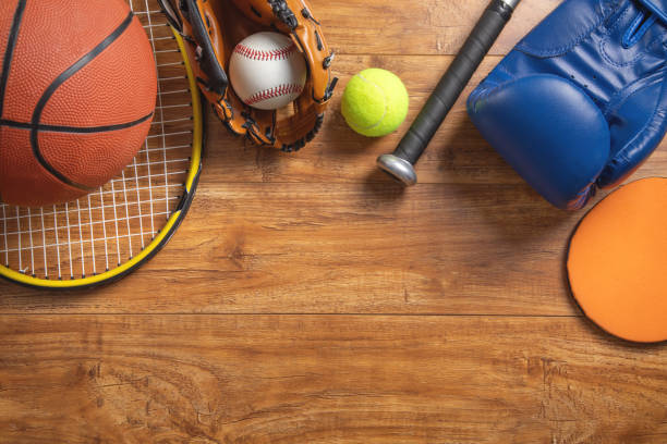 istock Various sport equipments on wooden background. 2181336920