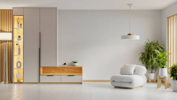istock Modern minimalist interior with an armchair and decor accessories on empty white color wall background- 3D rendering 2181339351
