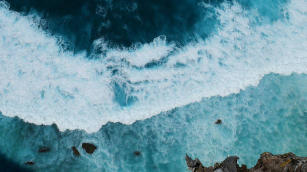istock Turquoise ocean sea water white wave pattern splashing deep blue sea. Seascape dark ocean background wave splash on rock. Tropical sea beach in summer seaside outdoor. Water Surface blue wave pattern 2181339770
