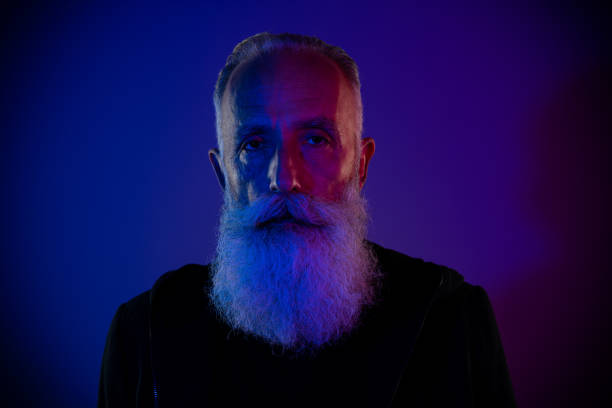 istock Photo of cool attractive retired man dressed black pullover looking you isolated dark blue color background 2181342823