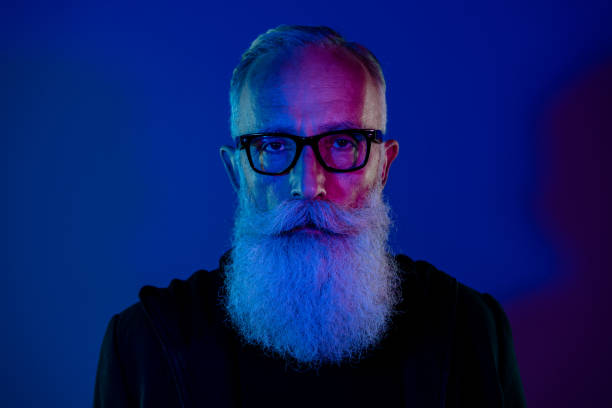 istock Photo of dangerous smart retired man dressed black pullover eyewear isolated dark blue color background 2181342886