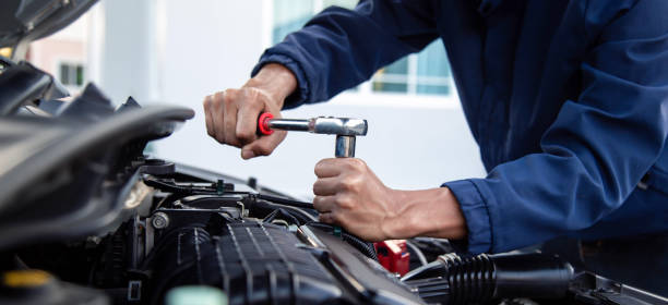 istock Professional mechanic working on the engine , repairing a car engine automotive workshop with a wrench, car service and maintenance,Repair service. 2181345107