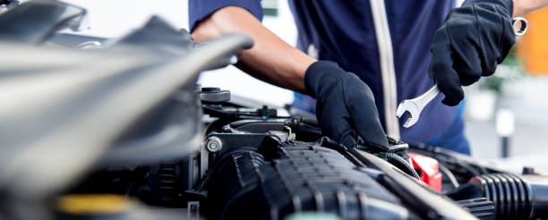 istock Professional mechanic working on the engine , repairing a car engine automotive workshop with a wrench, car service and maintenance,Repair service. 2181345110