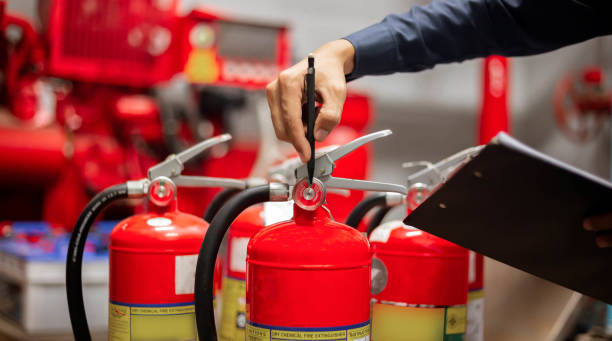 istock Engineer are checking and inspection a fire extinguishers tank in the fire control room for safety training and fire prevention. 2181345175