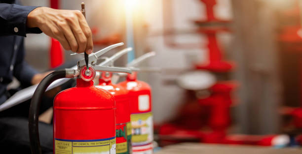 istock Engineer are checking and inspection a fire extinguishers tank in the fire control room for safety training and fire prevention. 2181345178