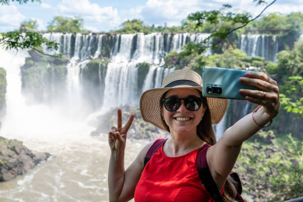 istock Happy tourist taking a selfie at Iguazu Falls. 2181356424
