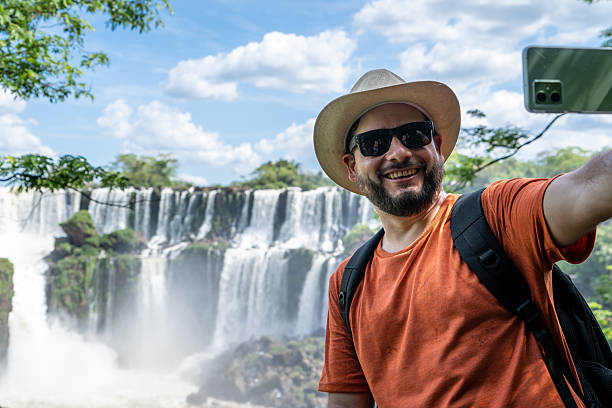 istock Happy man taking a selfie at Iguazu Falls. 2181356541