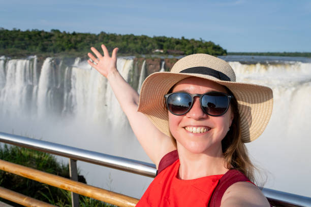 istock Tourist with hat taking a selfie in front of imposing landscape 2181359821