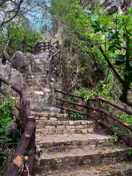 istock Winding stone stairs through shaded path at Marble Mountains, Da Nang, Vietnam 2181360037