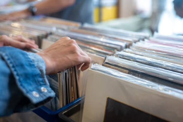 istock Young Asian Man shopping for vinyl records 2181361273