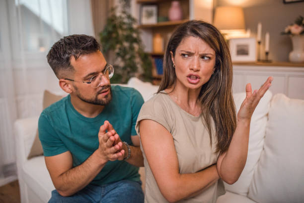 istock A loving couple has problems. They argue while sitting in the living room 2181363182
