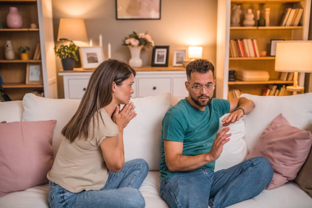 istock A woman begs her husband for forgiveness after an argument 2181363862