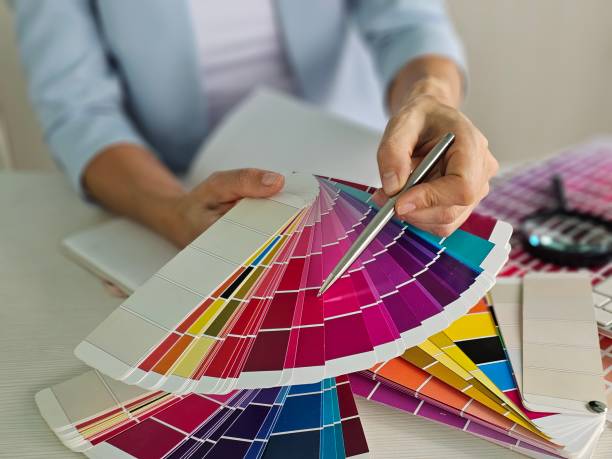 Designer showing color samples for apartment decoration closeup.