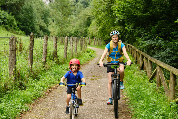 istock Mother and child cycling in nature 2181365310