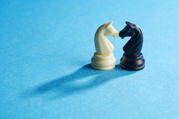 black and white knights on blue background