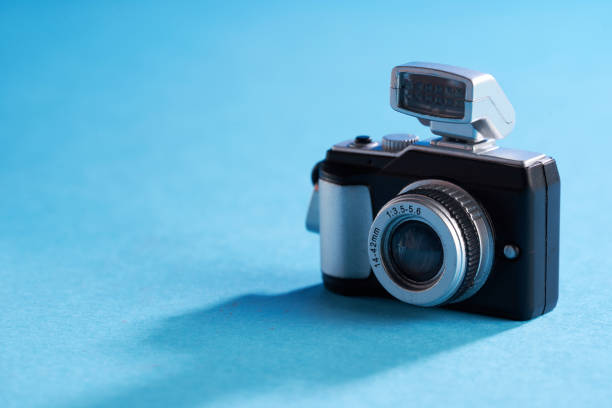 vintage small toy cameras on blue background