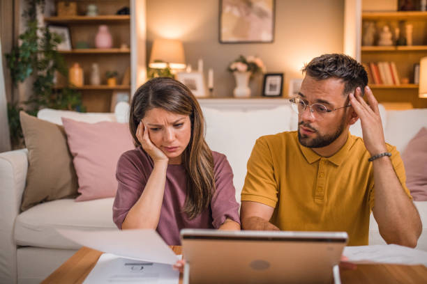 istock A loving couple is trying to solve debts and financial problems at home 2181366806