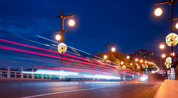 istock Highway car light trails at night - Xi'an, China 2181368315